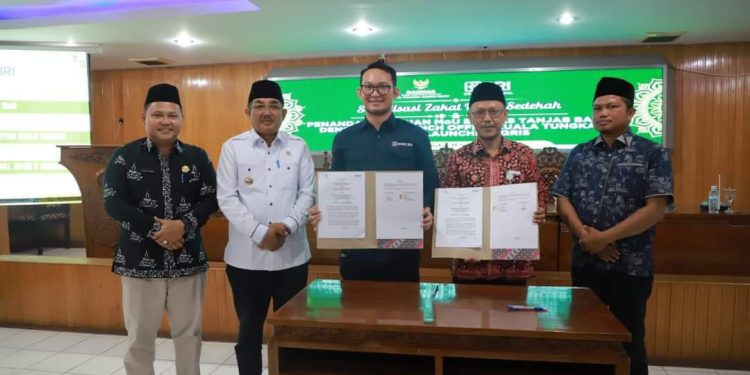 Bupati Tanjabbbar Resmikan QRIS Bersama BAZNAS dan BRI